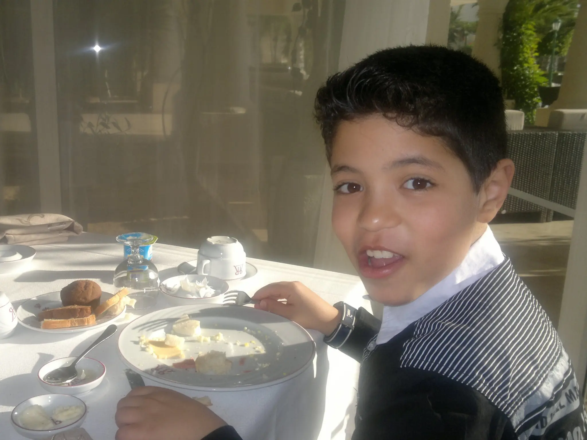 Charaf as a boy at the breakfast table in Algeria
