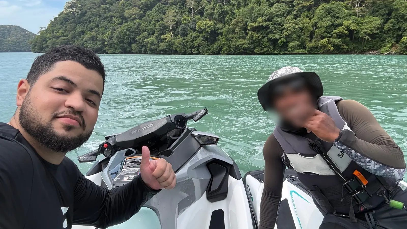 Charaf on a jet ski with a friend in Langkawi