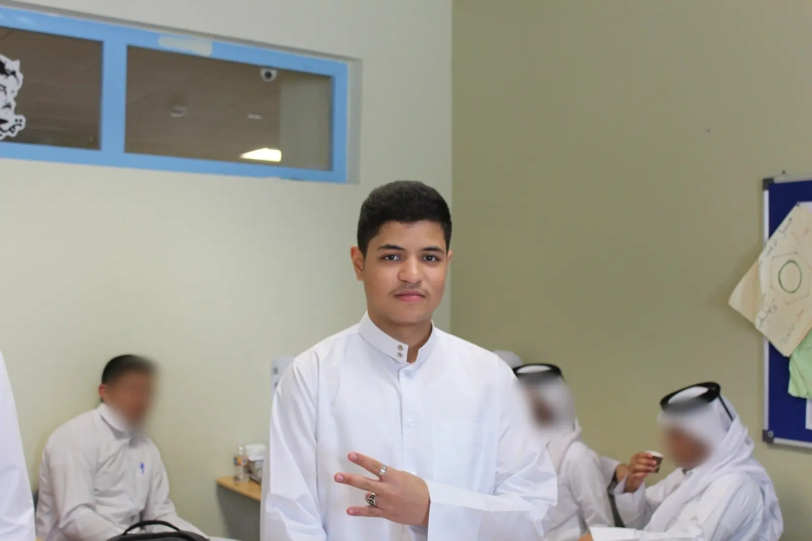 Charaf as a teenager at school in Qatar